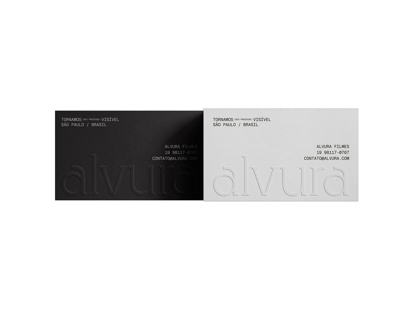 Alvura Filmes branding black and light grey business cards flat-lay by Gabriel Pio Couto and Edson Naves