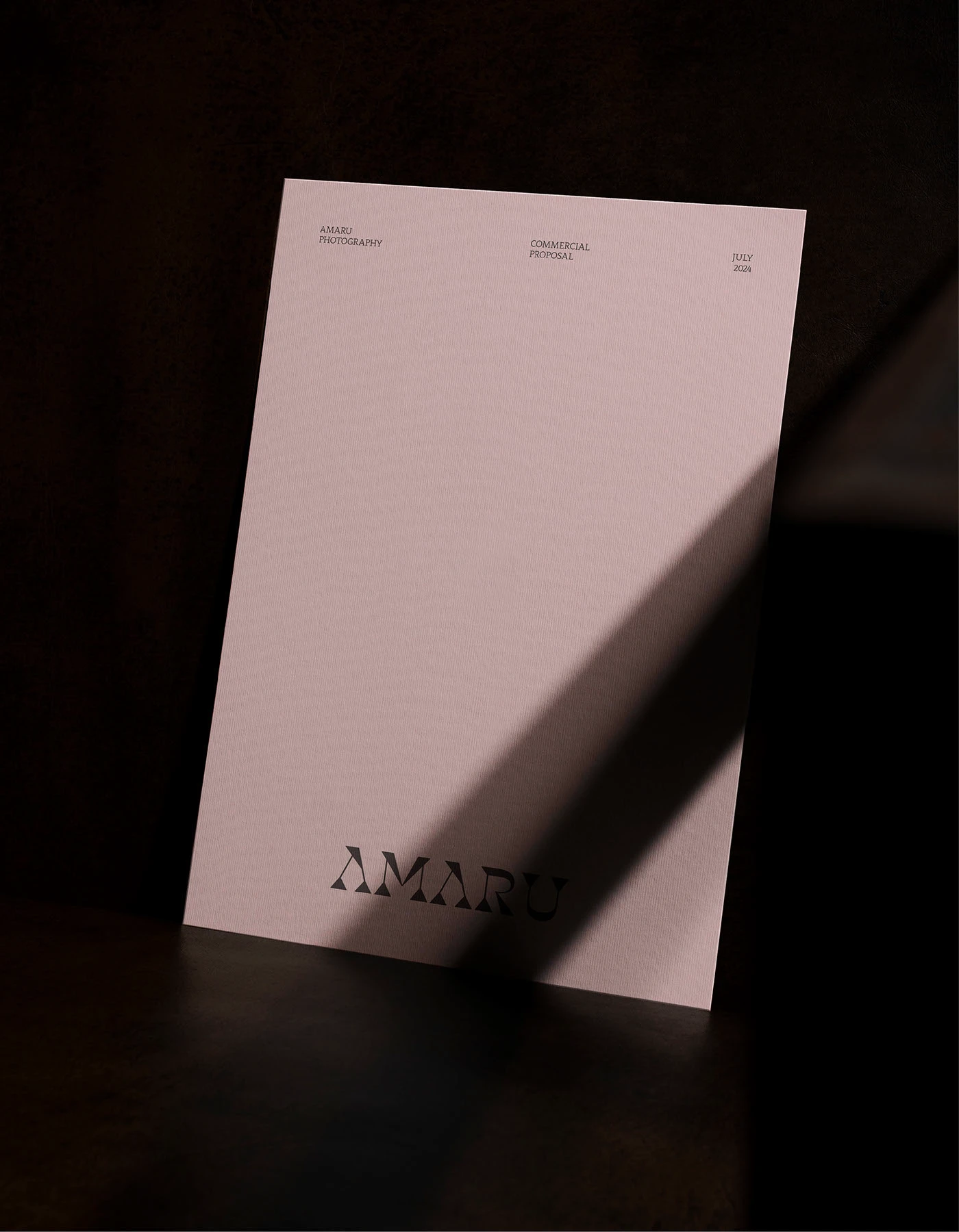 Amaru photography brand identity proposal folder with dramatic light shadow