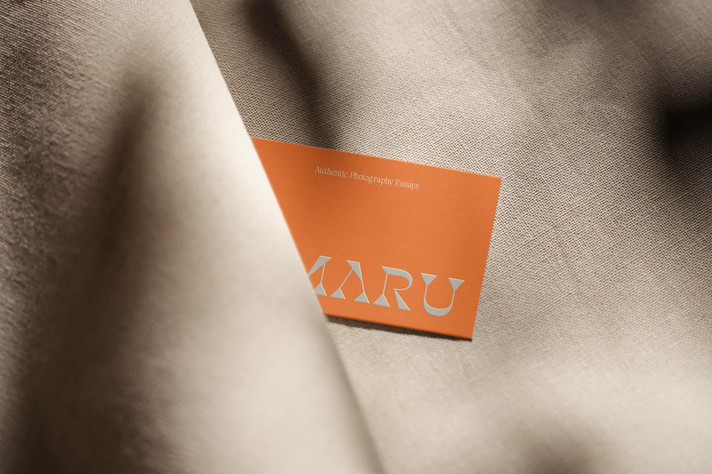 Amaru photography brand identity terracotta business card in linen fabric folds