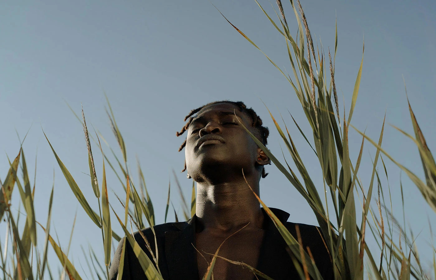 Amaru photography brand identity portrait of model in natural tall grass