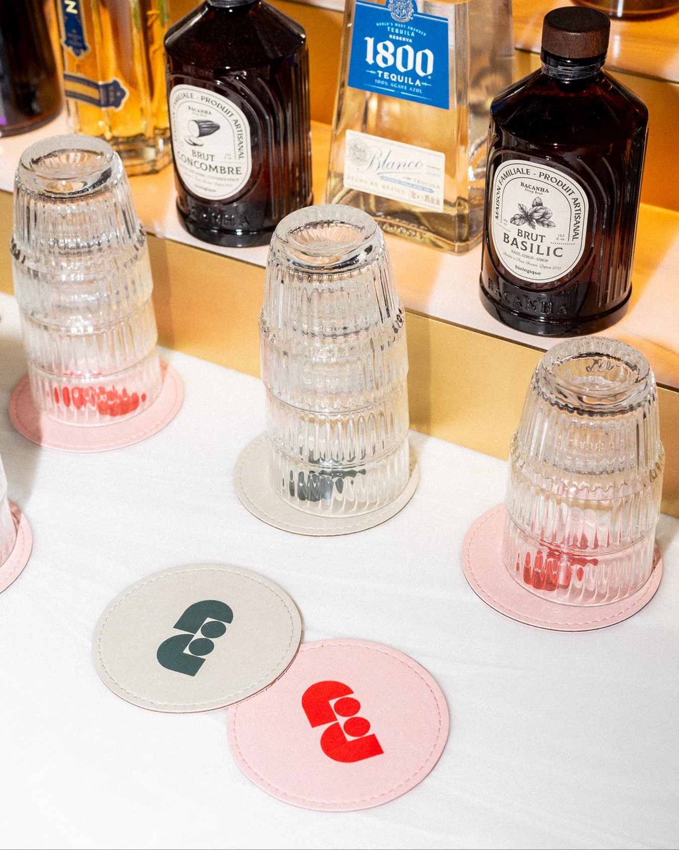 Faubourg Galant branding pastel leather cocktail coasters at the hotel bar