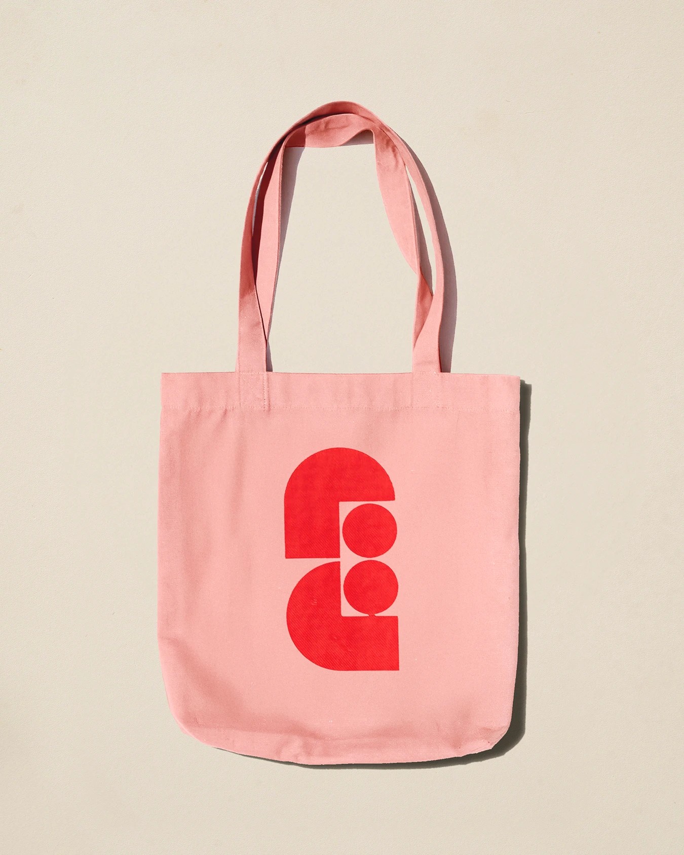 Faubourg Galant branding pink canvas tote bag with red arch monogram