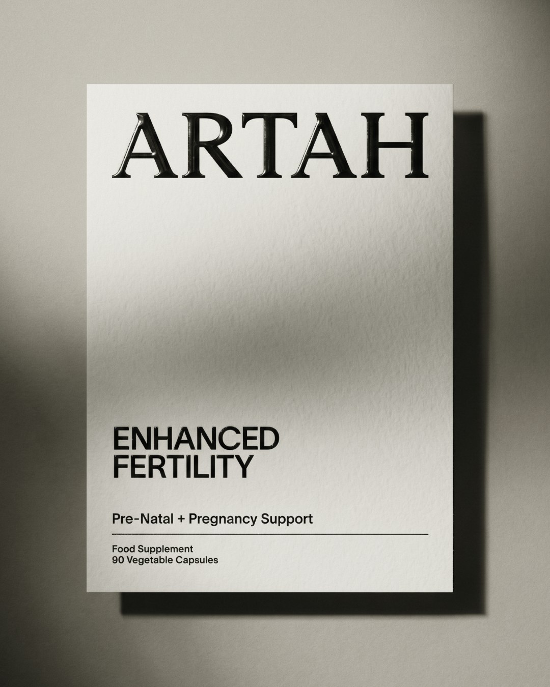 Tactile white outer carton packaging with glossy embossed Artah wordmark and clean typography in branding design