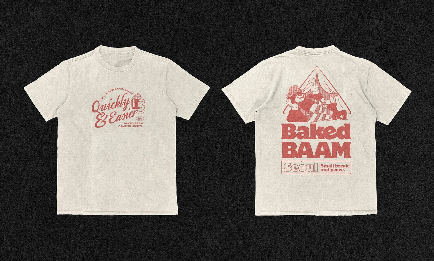 Black graphic t-shirt featuring Baked Baam character graphics and brand messaging - bakery packaging design by Monga Design