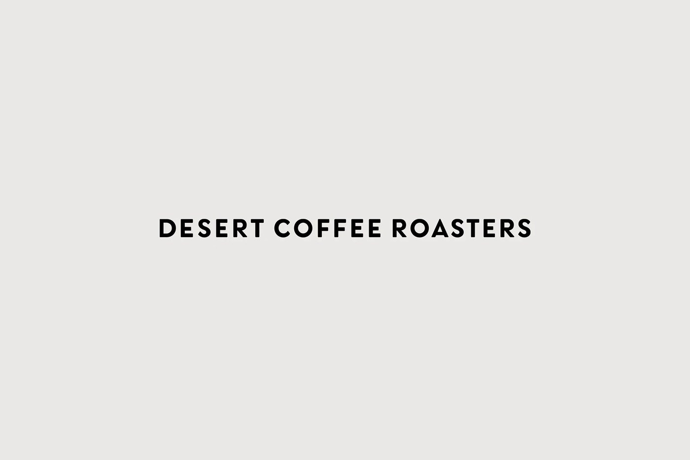 Desert Coffee Roasters typographic wordmark on neutral grey field branding