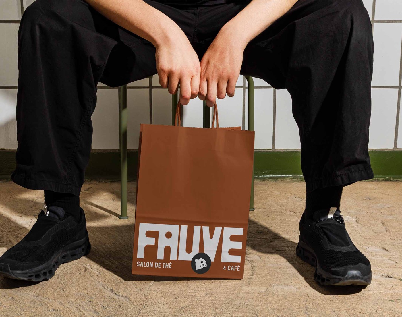 FAUVE brand identity takeaway paper shopping bag with bold white logo mark