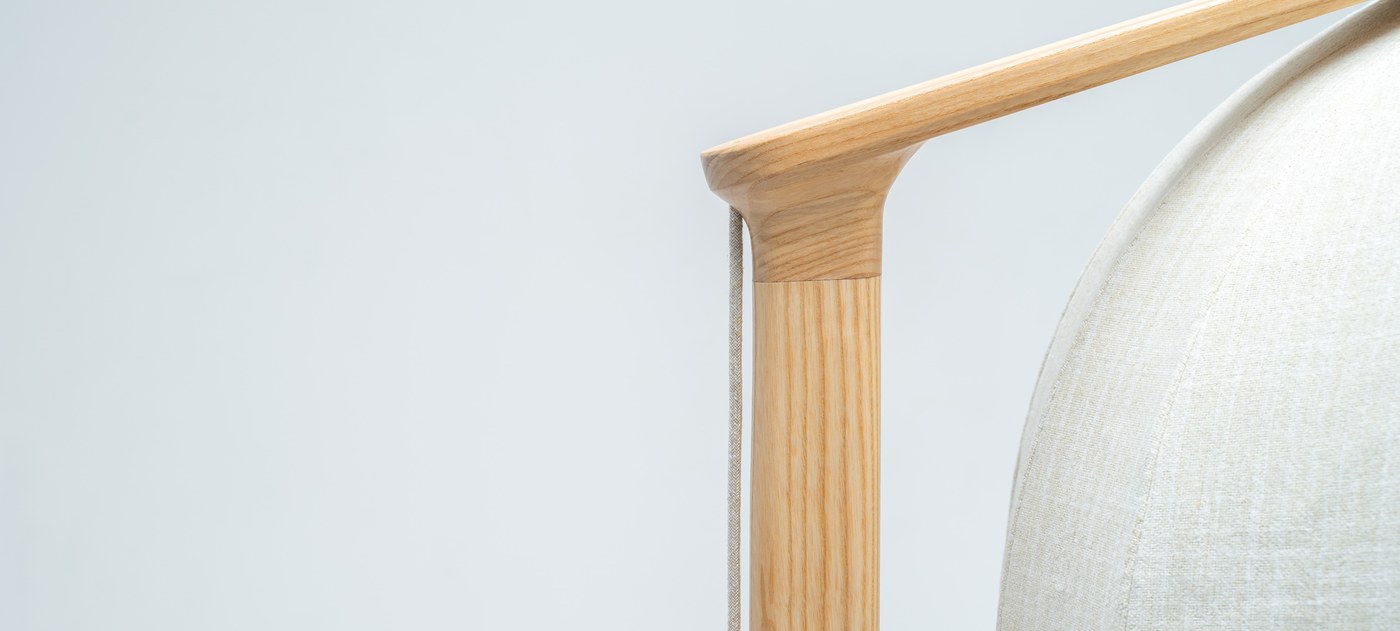 Joinery detail of curved solid wood overhead mast on Shanti chair industrial design