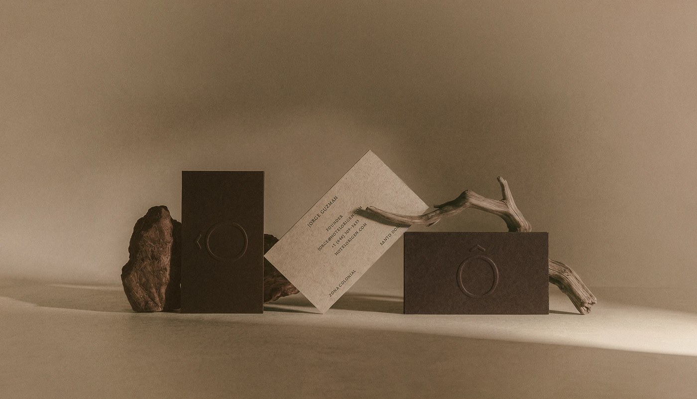 hotel rigen fugitiva .co branding business cards on a textured beige surface