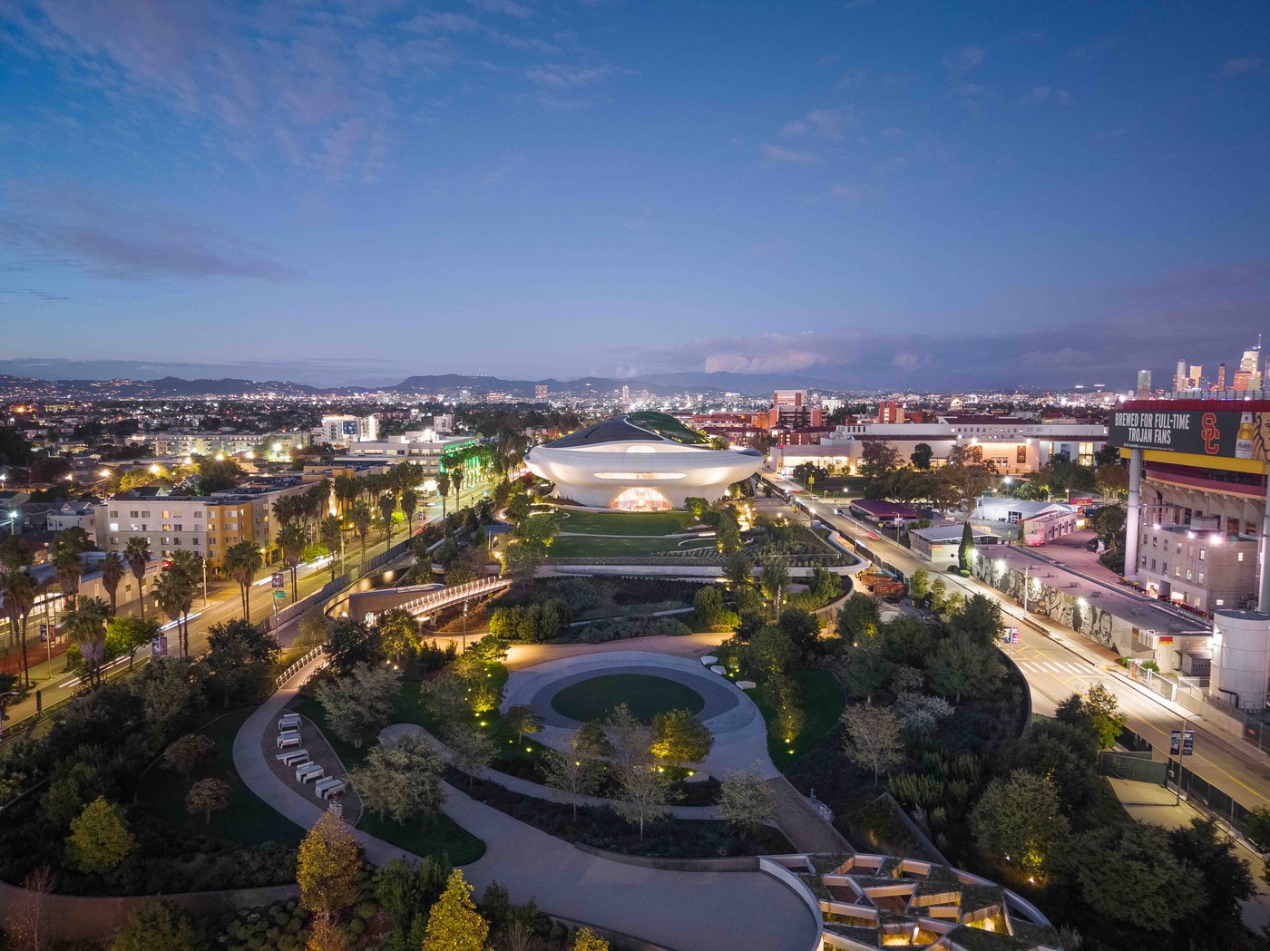 Civic entrance plaza and pedestrian gateway beneath the Lucas Museum in Los Angeles