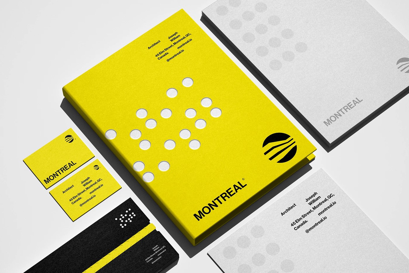 Montreal Architecture brand identity stationery flat lay with yellow presentation box and cards