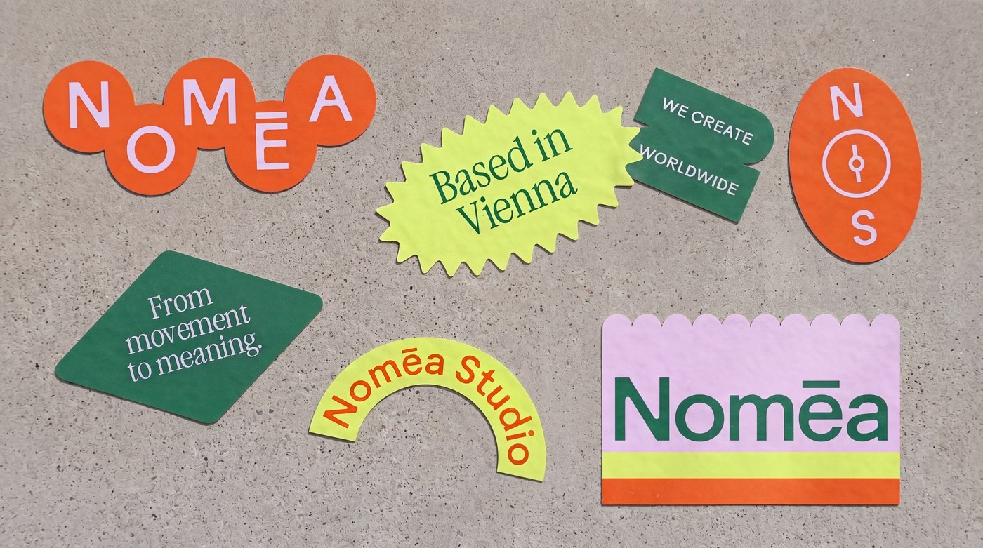 Nomēa Studio die-cut sticker badges and stationery branding