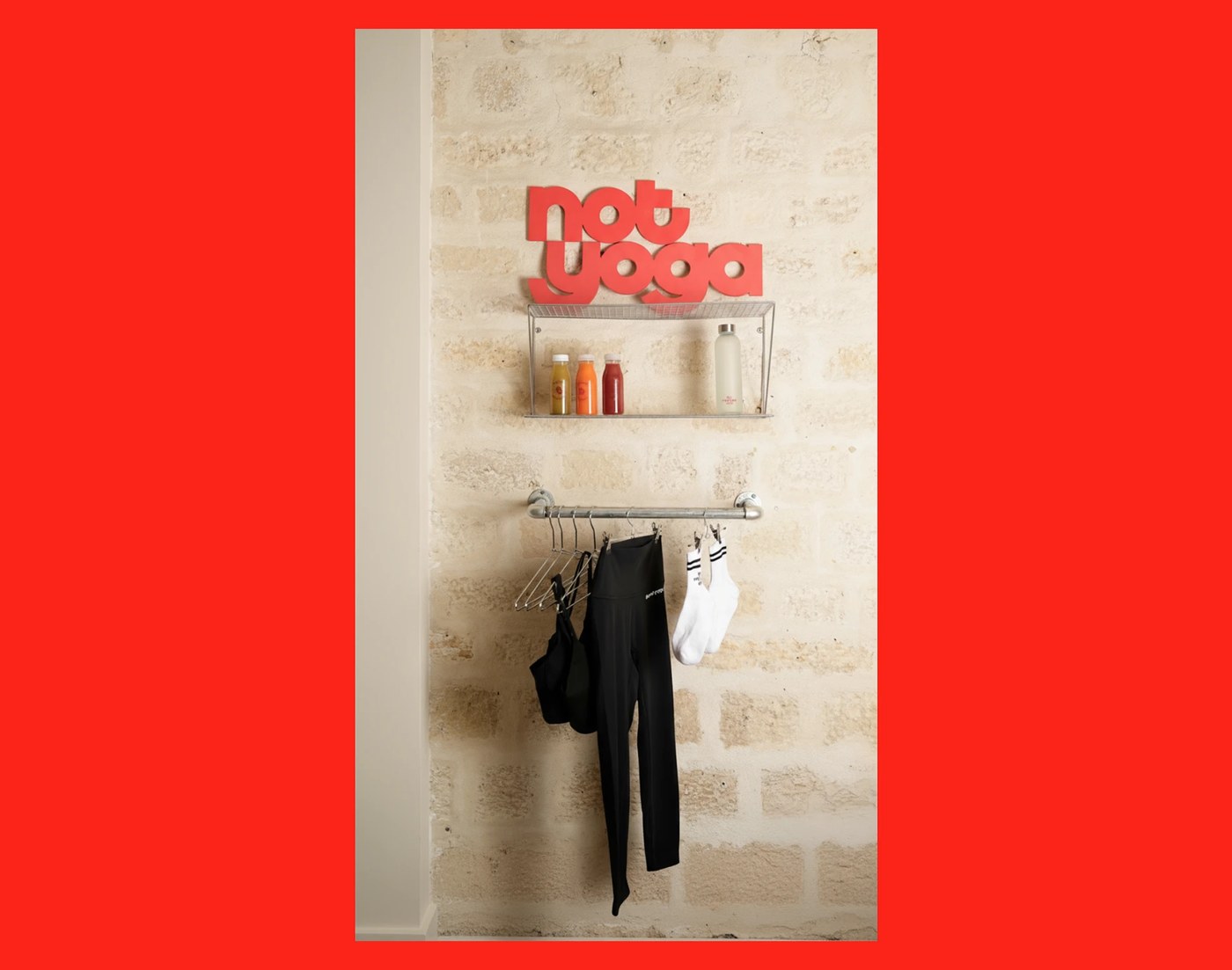 interior retail display and workout apparel collateral on limestone wall