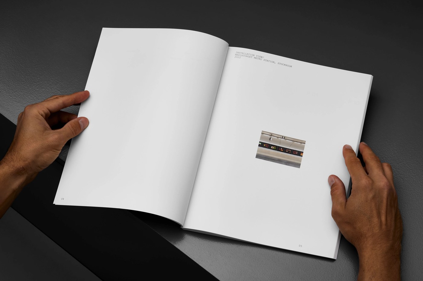 Open book spread showing Mariatorget subway installation detail and spacious negative margins — editorial design by Lundgren+Lindqvist