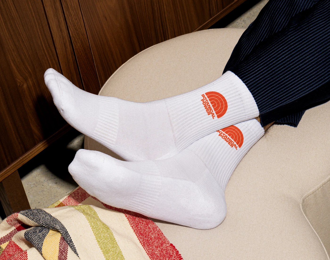 Plom athletic ribbed socks with jacquard knit symbol — brand identity by Brand Brothers