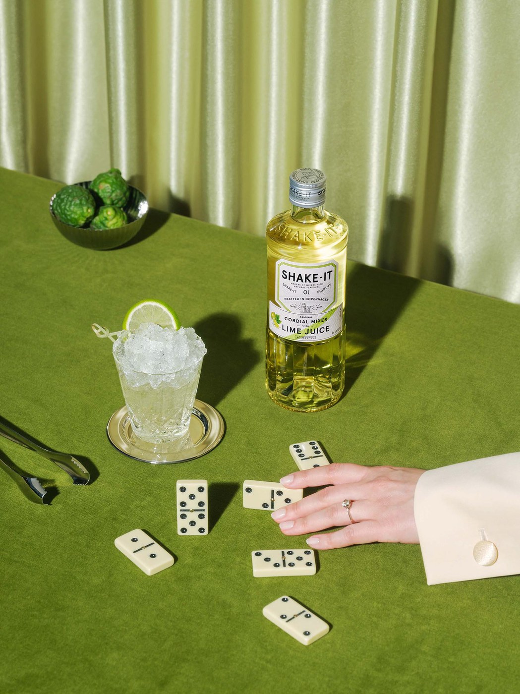 Fluted glass bottle and Shake-it Lime Juice cordial in packaging design by OlssønBarbieri