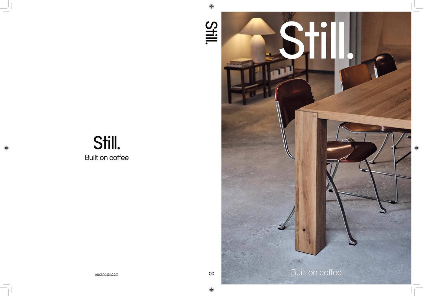 Still Magazine Issue 00 physical cover resting on natural wood surface in editorial design