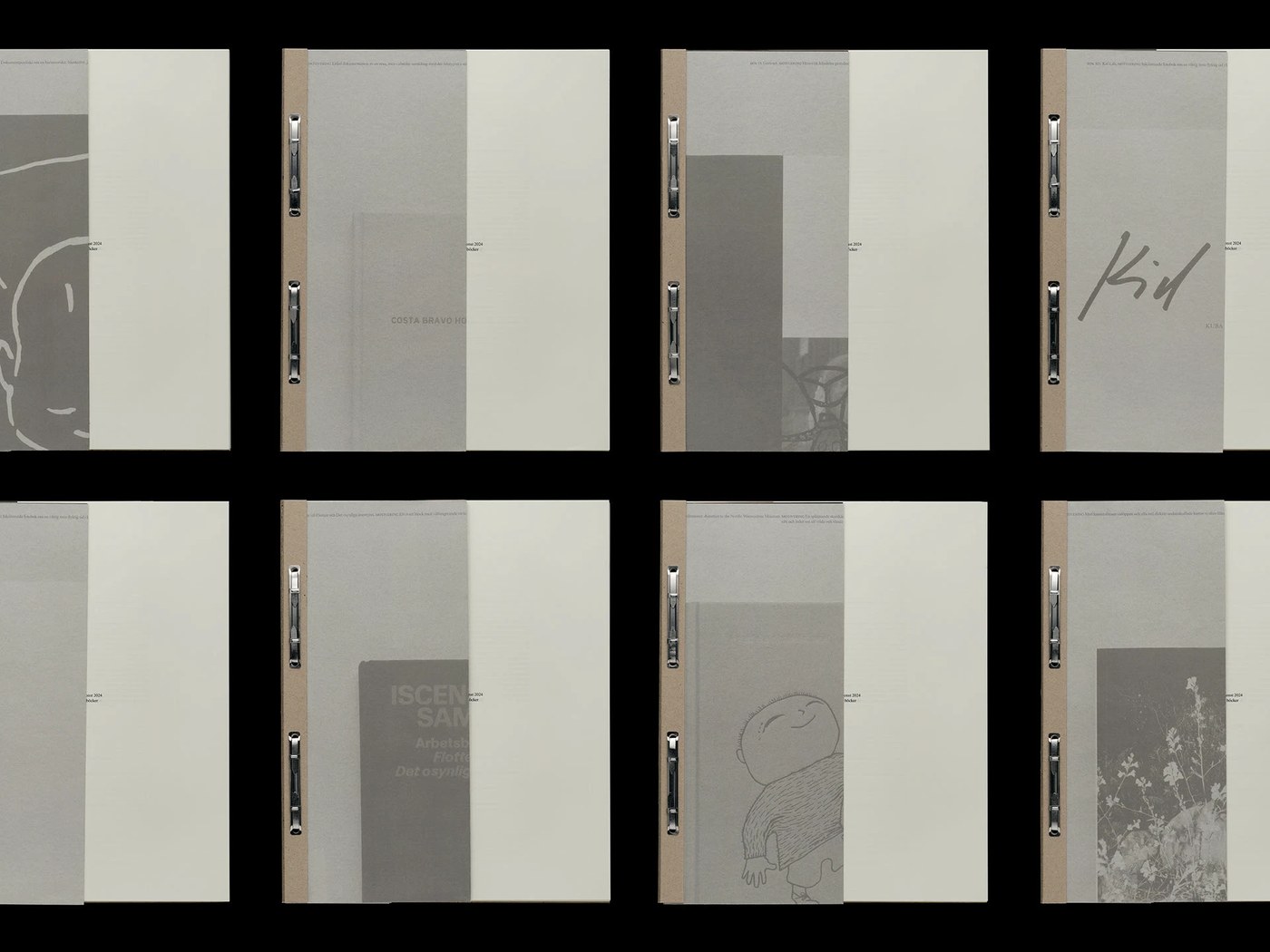 Multiple copies of Svensk Bokkonst catalogue showcasing prong-fastener binding and variable covers in editorial design