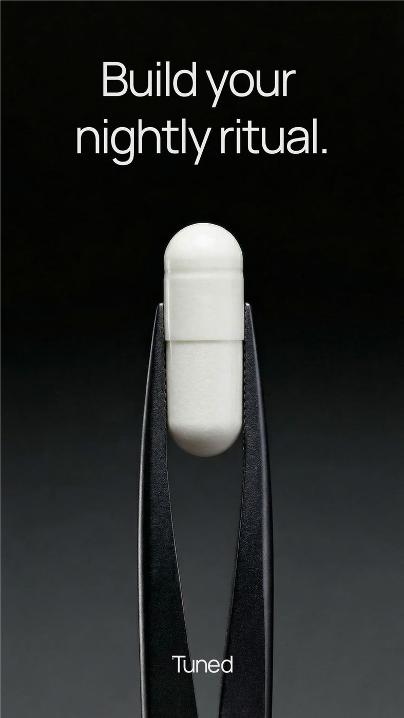 Macro editorial photography of tweezers holding a white Tuned sleep capsule