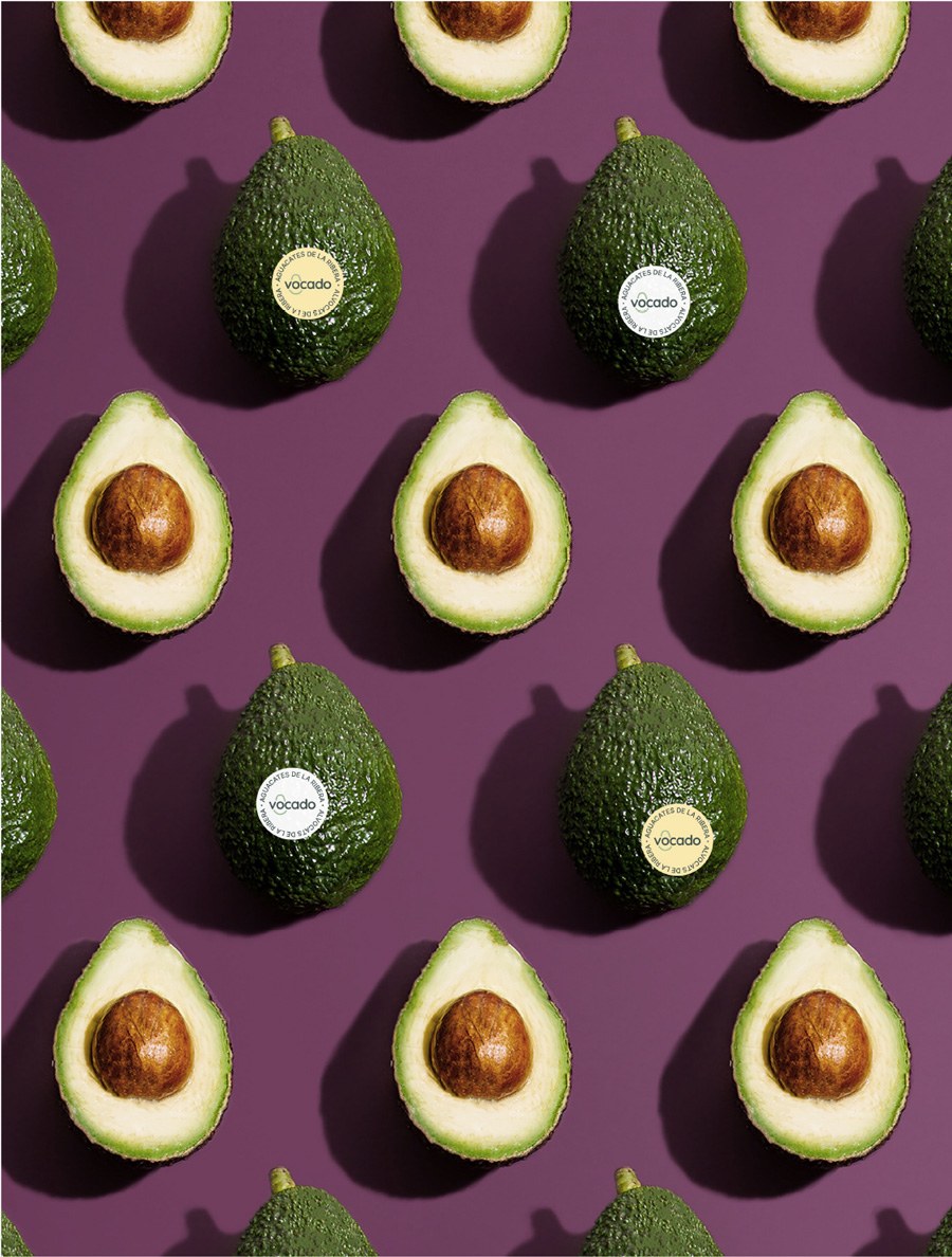 Minimalist avocado fruit composition on warm neutral backdrop