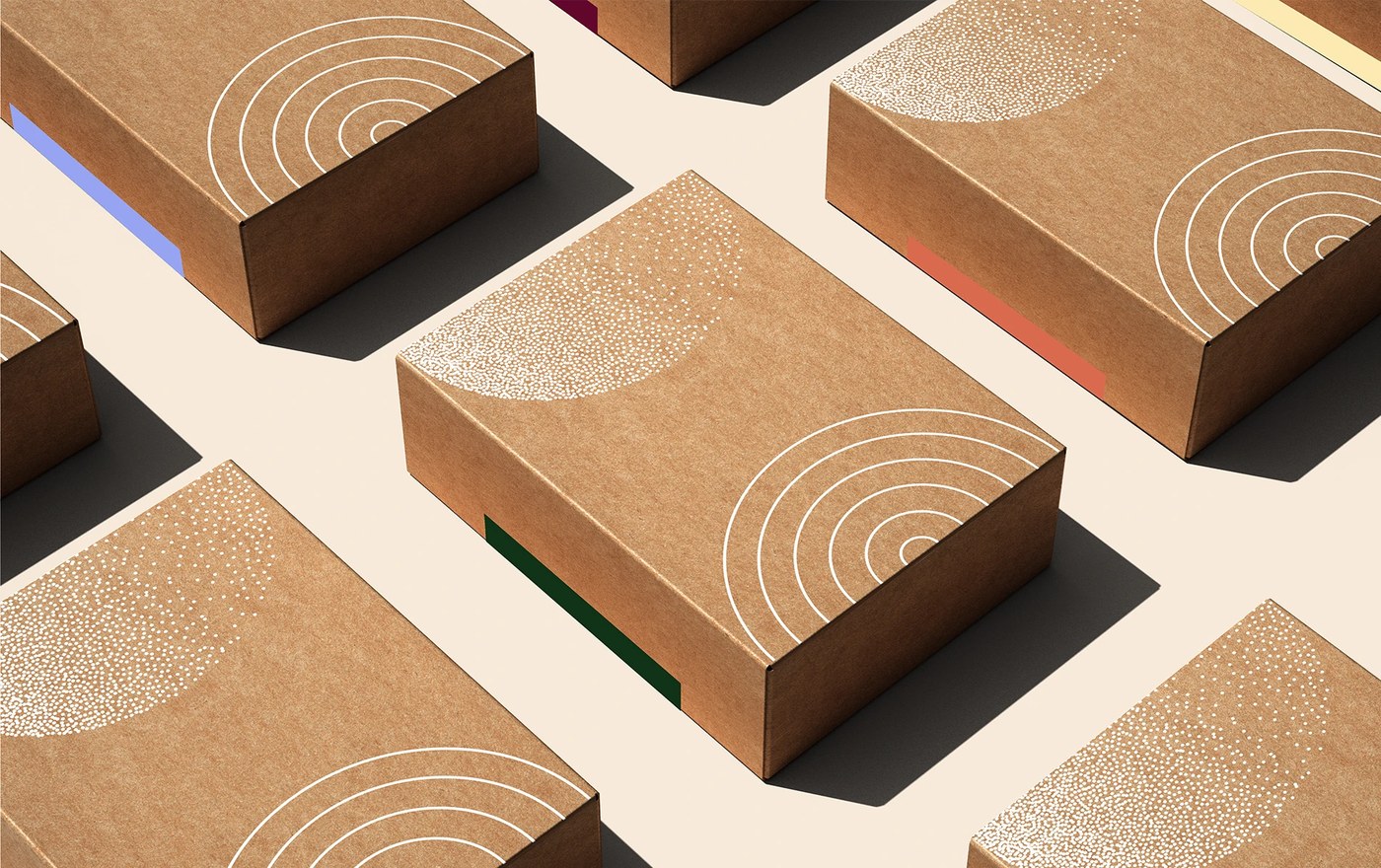 Kraft corrugated shipping boxes featuring white silkscreened concentric ring arcs and stippled patterns in packaging design