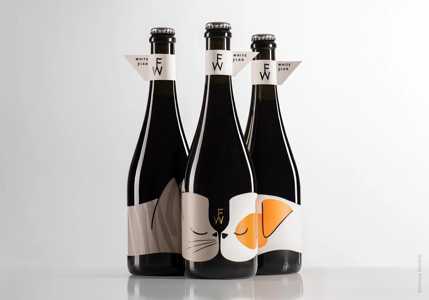 Dark glass wine bottle edition and label in packaging design by Backbone Branding