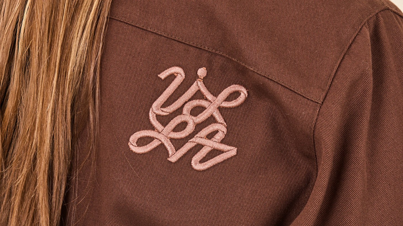 W.T.VILLA branding design heavy cotton twill jacket with embroidered copper knot monogram by María Centeno