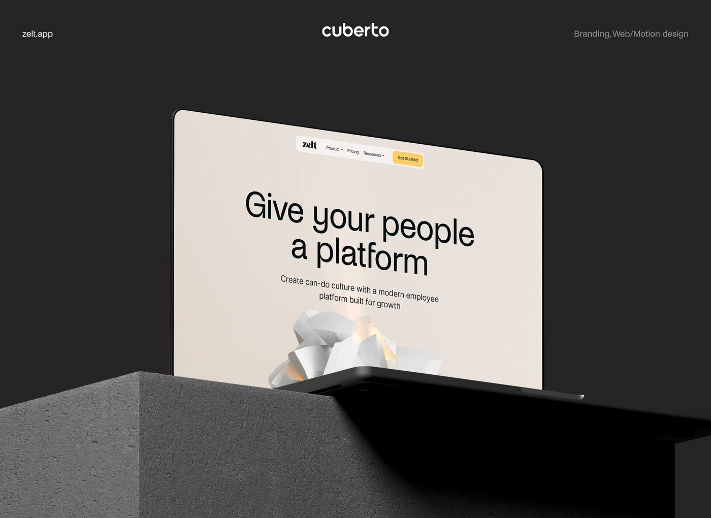 Zelt web design hero section displayed on laptop screen atop textured concrete plinth