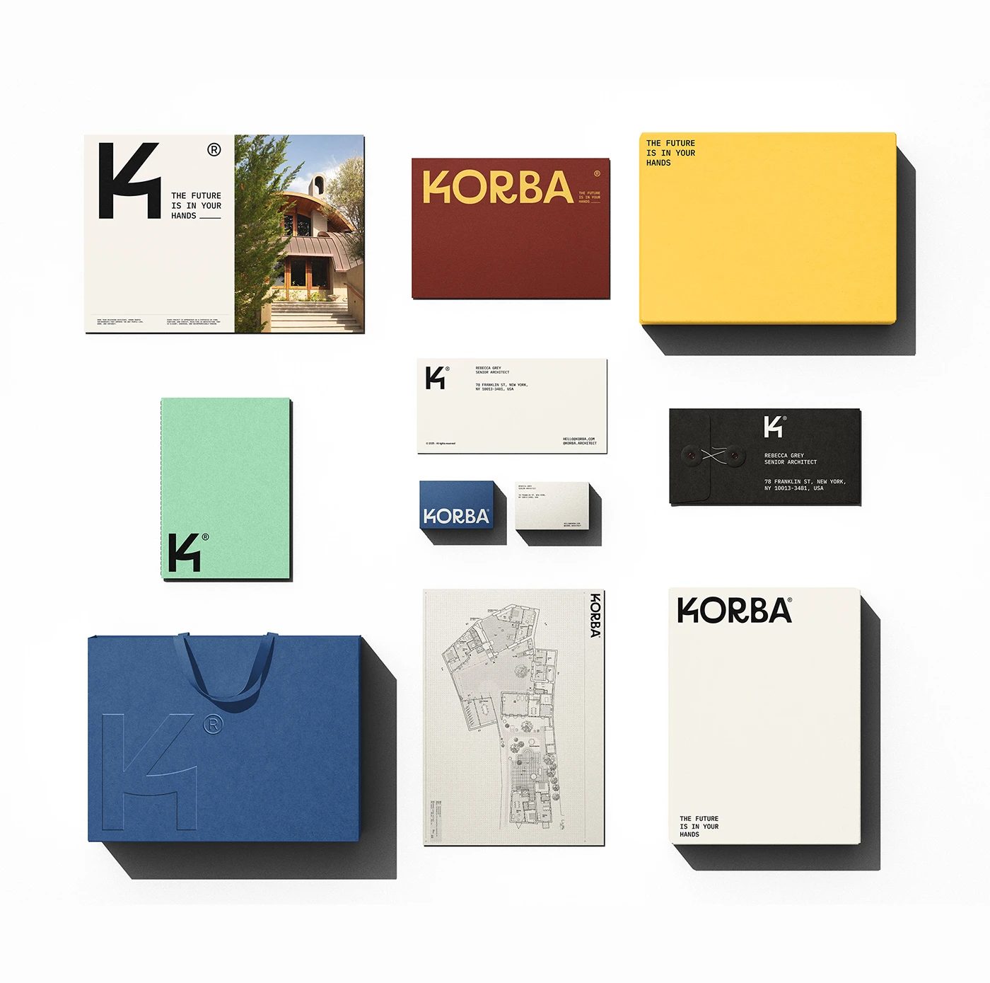 KORBA architectural studio branding stationery flatlay with blue tote bag and blueprint