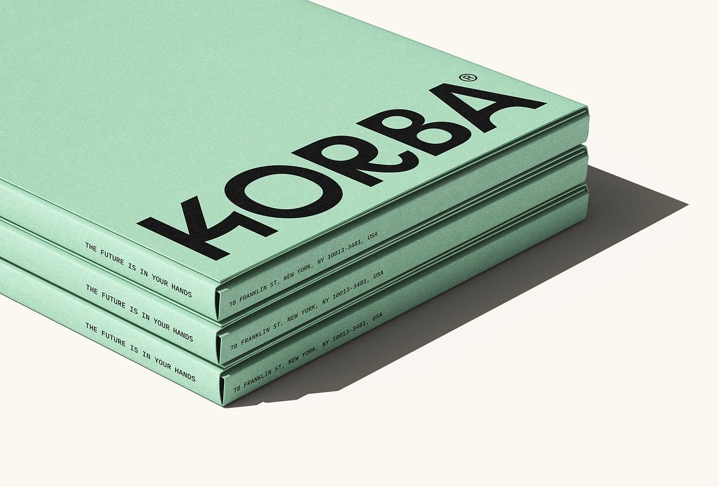 KORBA architectural studio branding mint green stacked book covers and wordmark