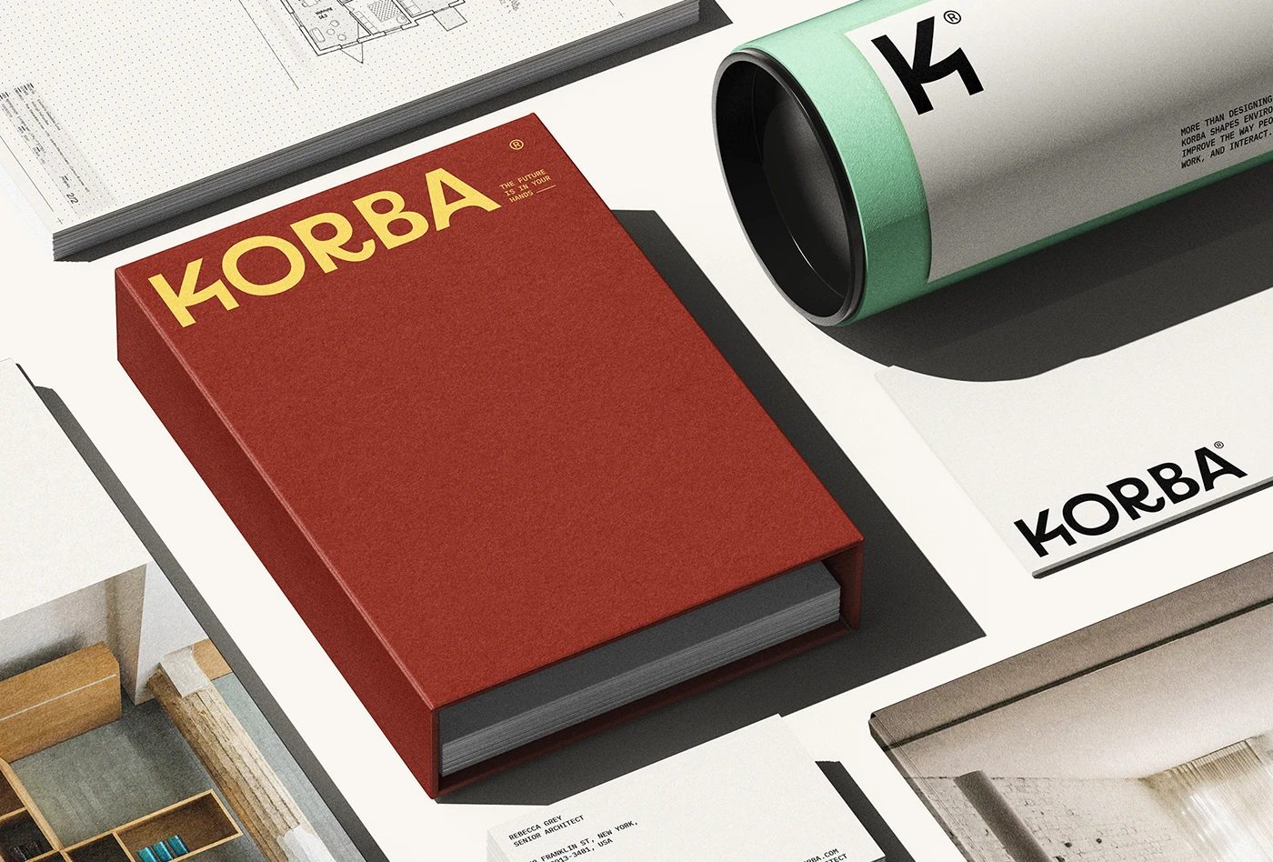 KORBA architectural studio branding red book cover and mint shipping tube