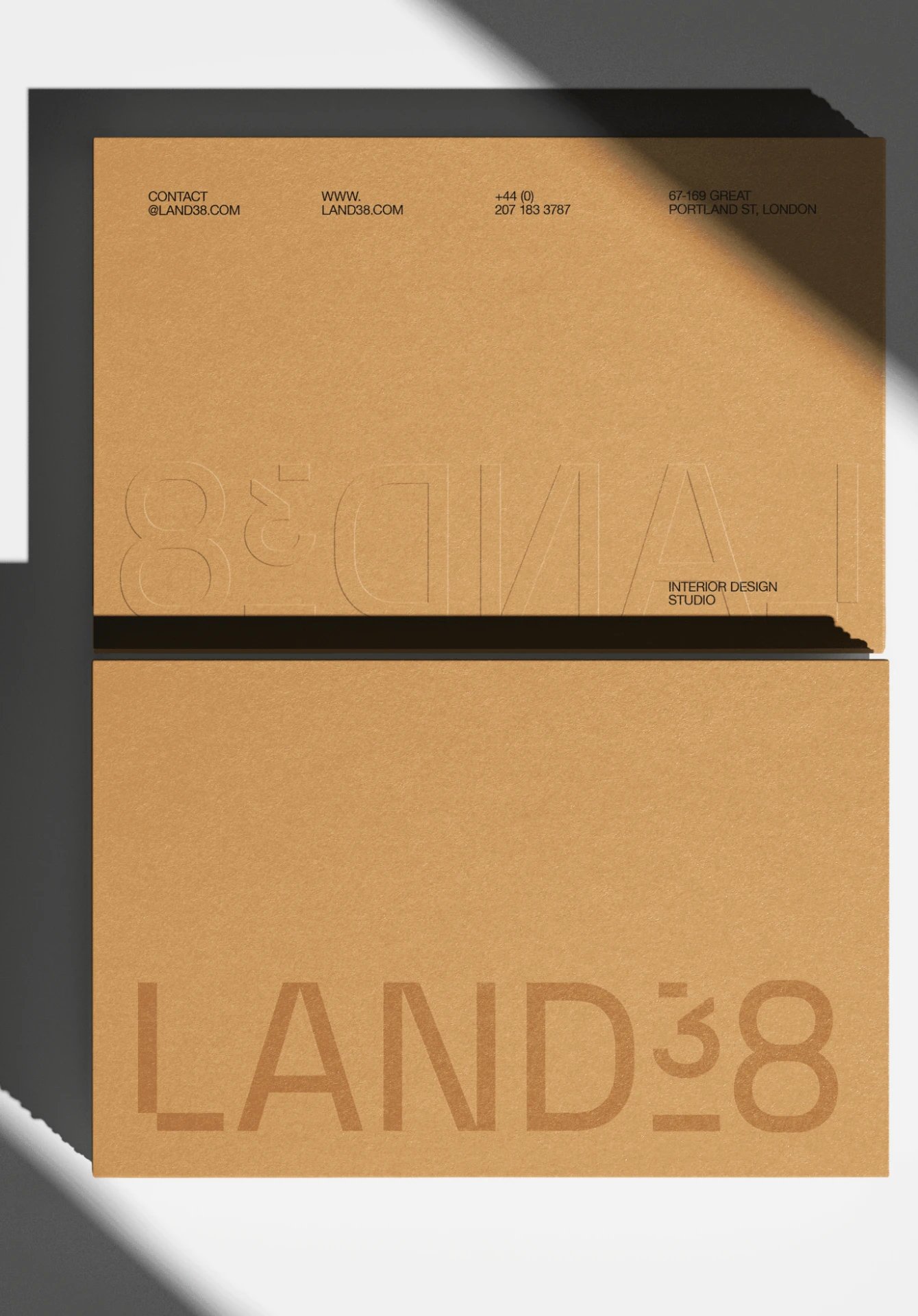 Blind debossed kraft paper business cards for LAND38 brand visual identity