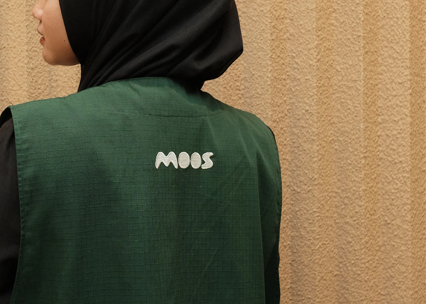 Moos embroidered staff vest branding asset detail