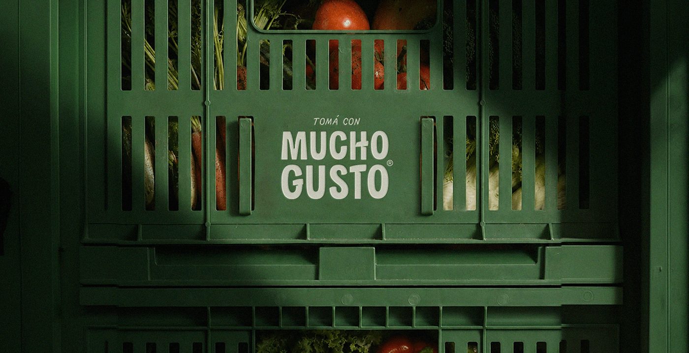 Mucho Gusto beverage branding crate with printed logo mark
