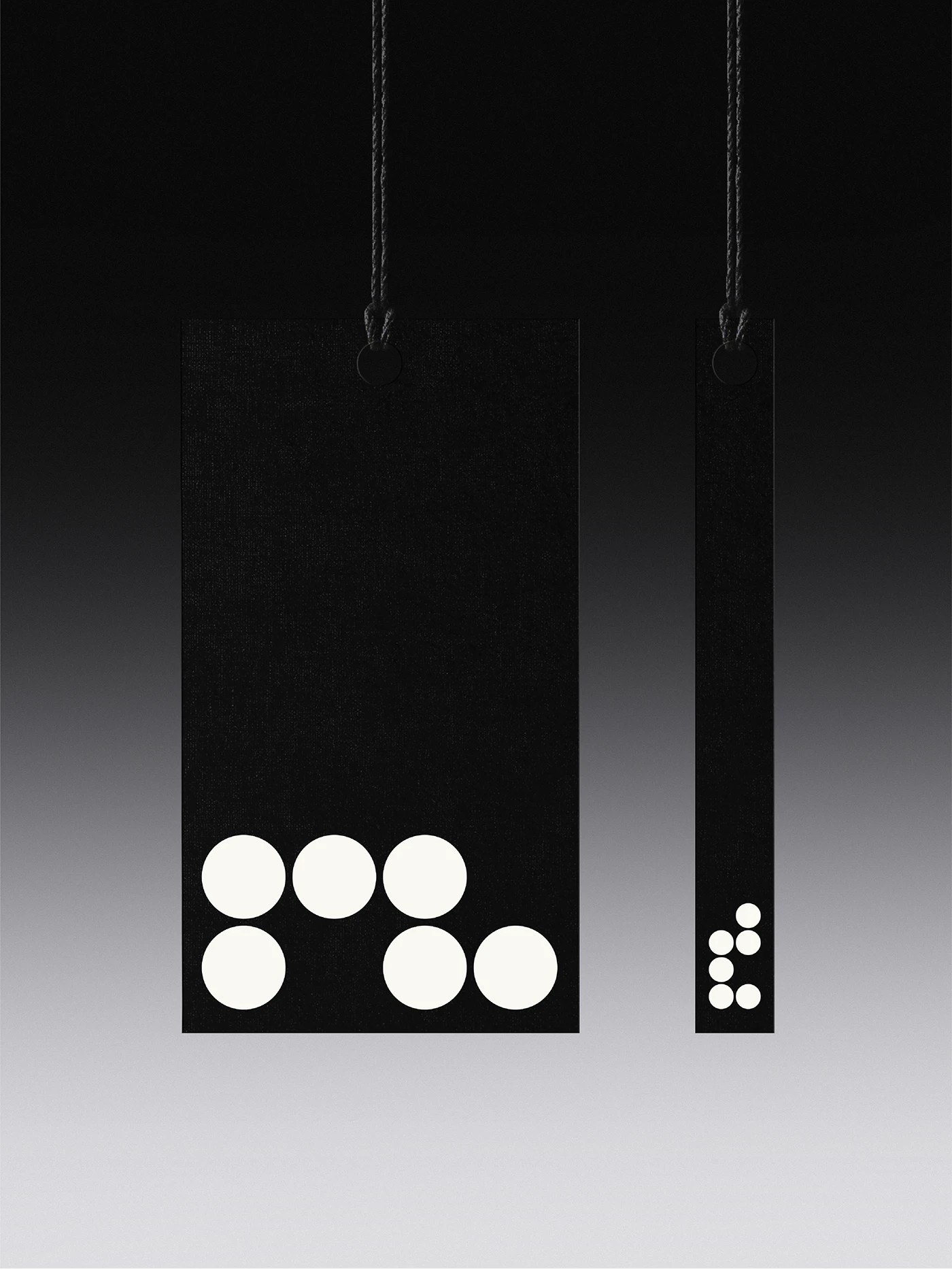 Runlab branding die-cut black apparel hangtags on string cord