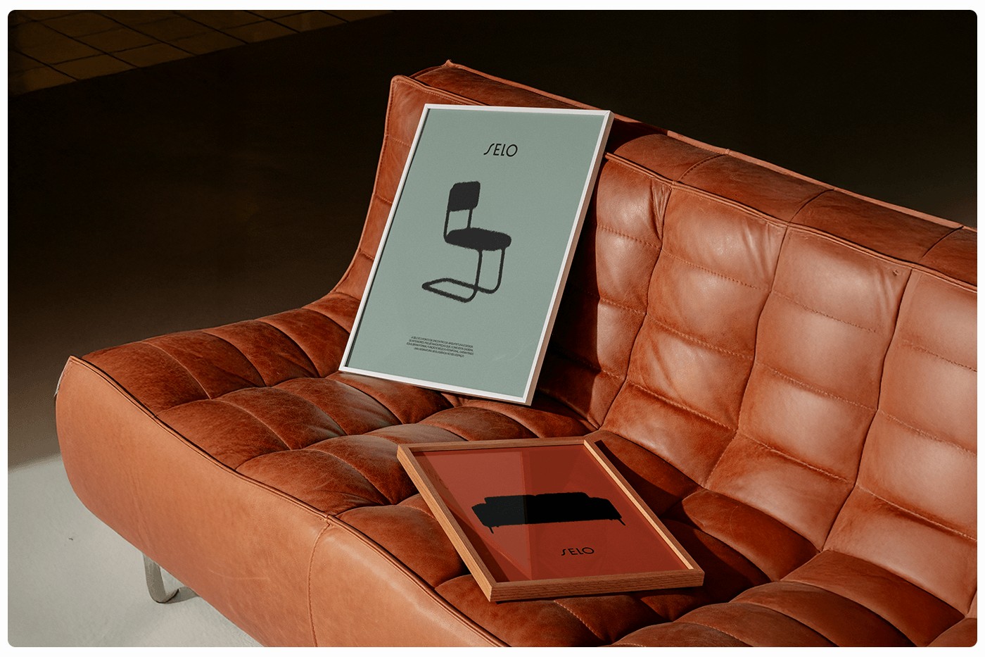 SELO furniture brand identity framed prints on cognac leather sofa