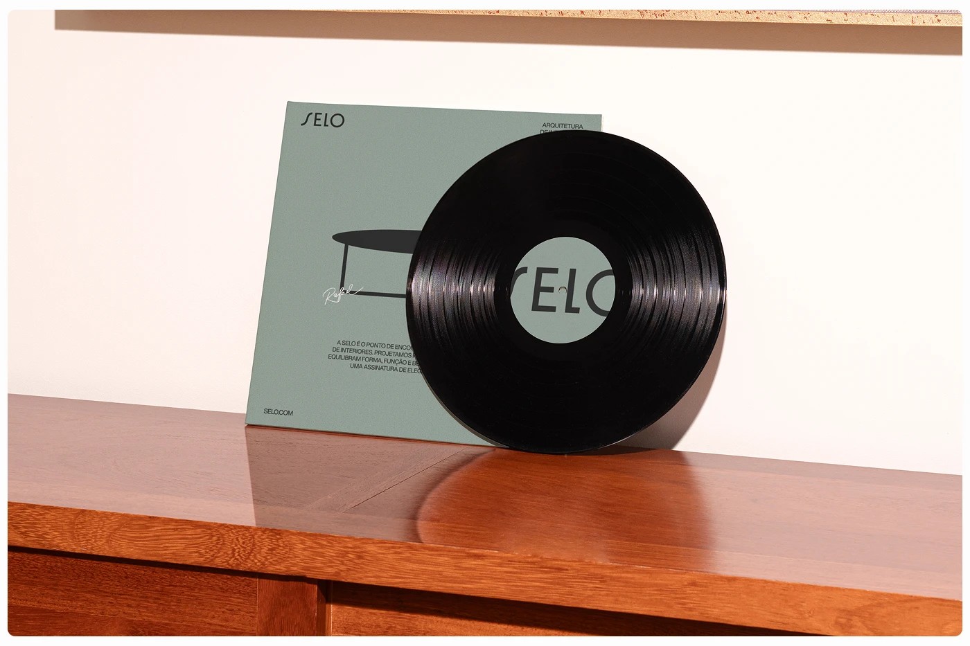 SELO furniture brand identity vinyl record on mid-century wood credenza